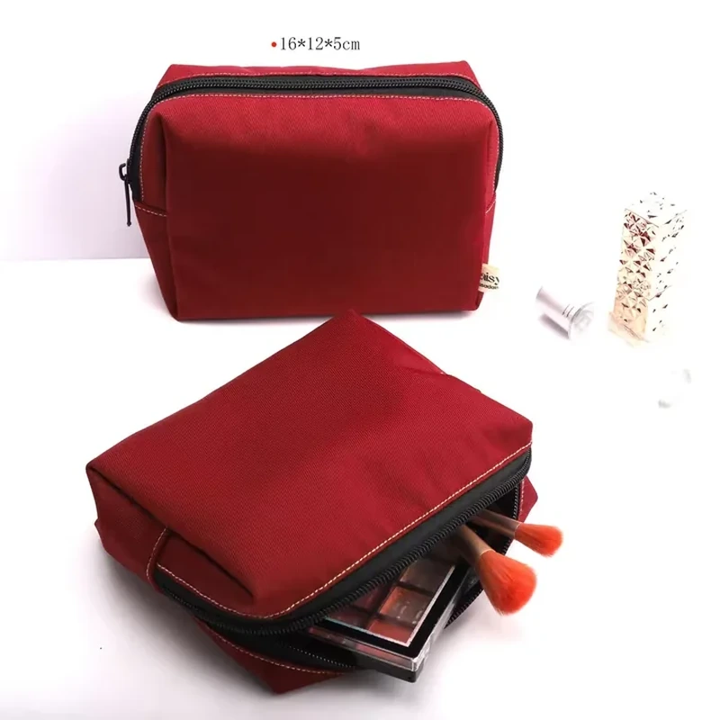 Red zip-around makeup organizer shown closed and opened with cosmetics inside