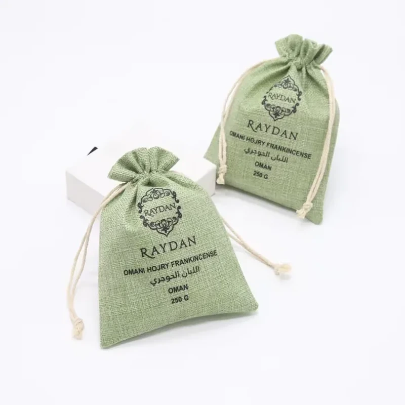 Green woven sachet bags with botanical printing and cream cords