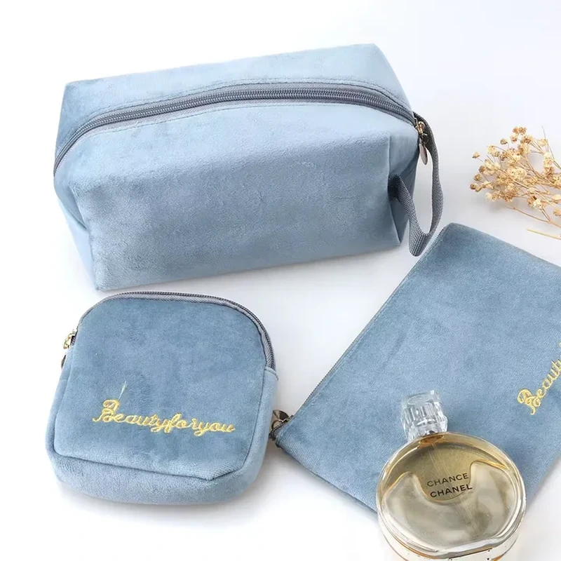 A rectangular zip case has softly boxed ends and a small side loop