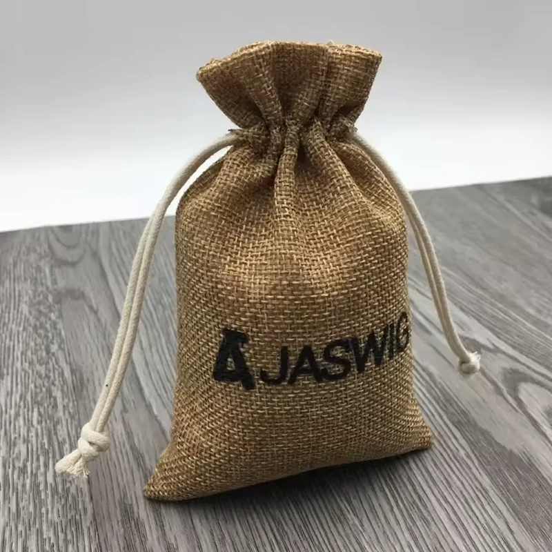 A natural brown pouch has a visibly coarse woven surface and a gathered cord neck