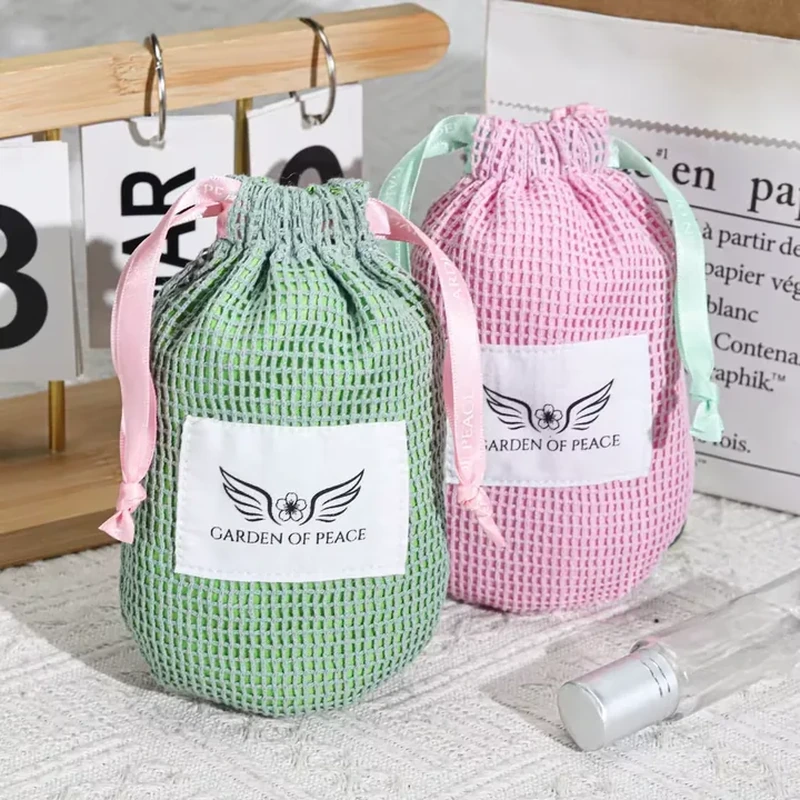 Pastel cylindrical mesh beauty pouches with broad front labels and ribbon drawstrings