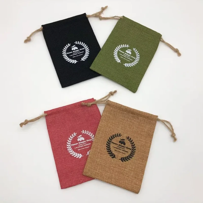 Flat woven gift pouches with printed emblems and knotted cords