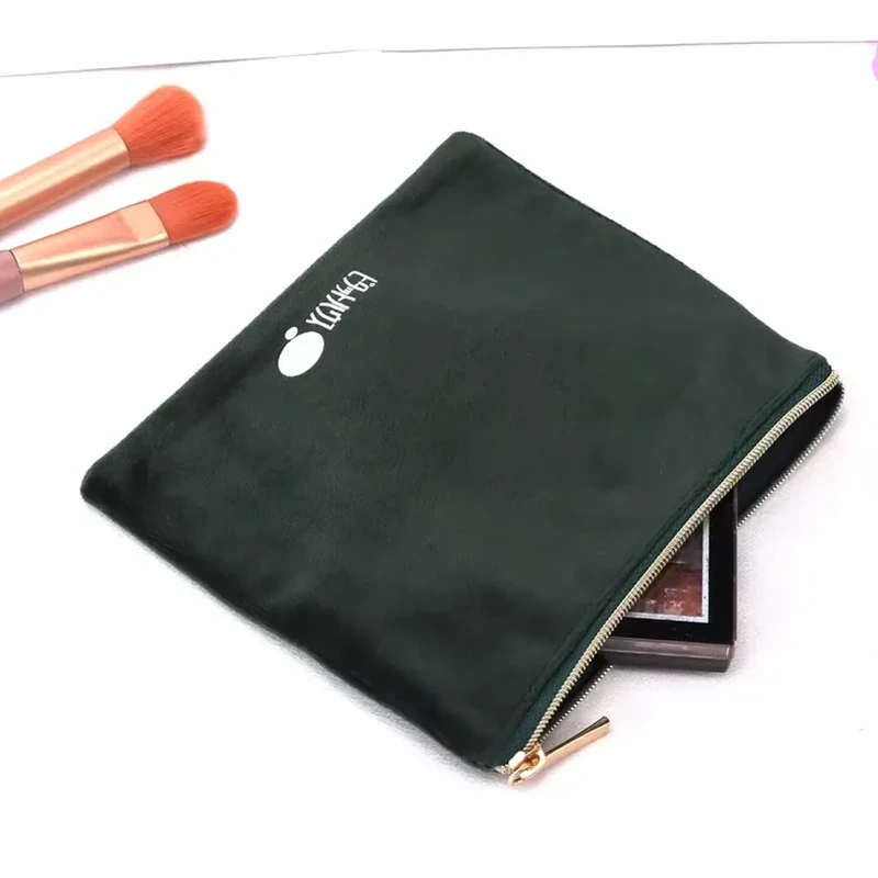 A slim rectangular pouch uses a straight zipper along its long edge