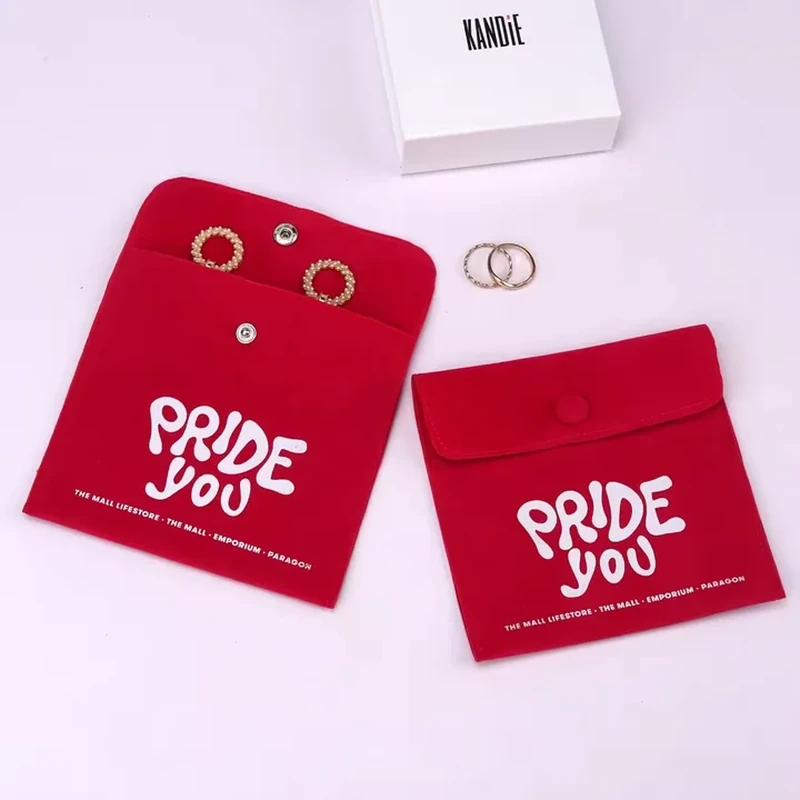 A foldover snap pocket opens to show earrings against its shaped display panel