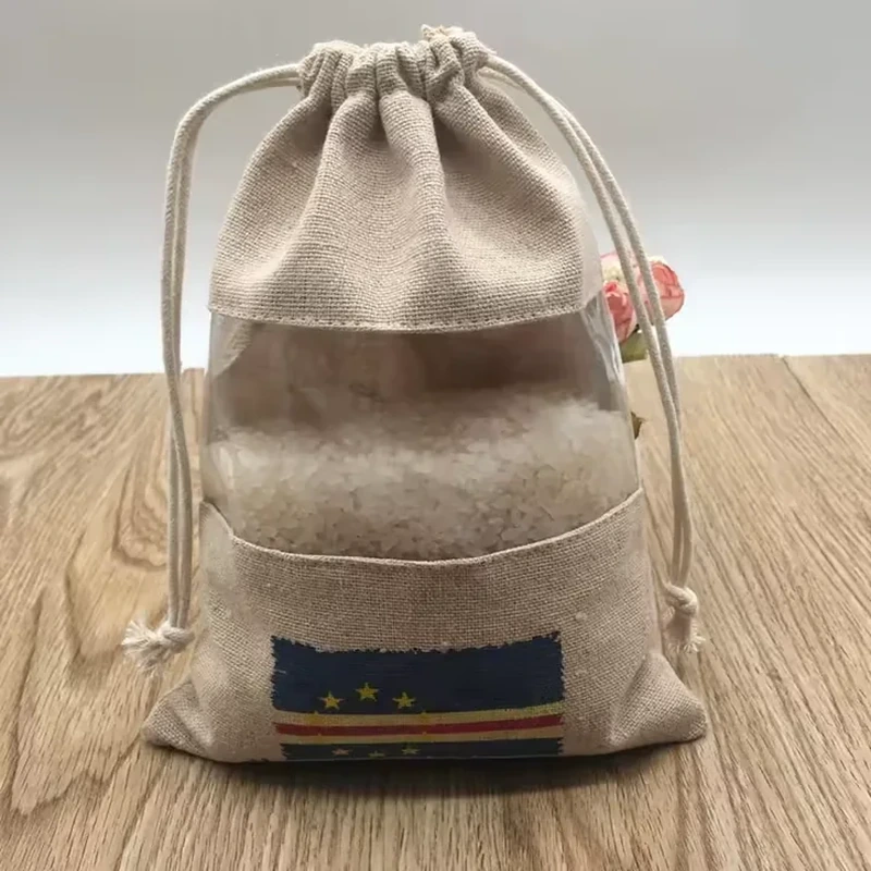 Woven drawstring bag with a front pocket, contrasting band and fabric label