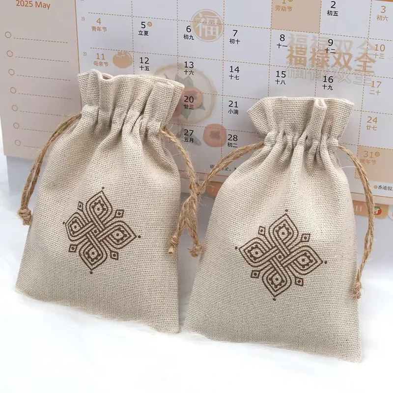 Light woven pouches with brown geometric motifs and natural drawstrings