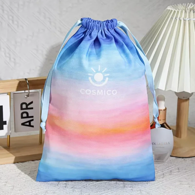 Tall drawstring bag with a blue, pink and orange gradient print