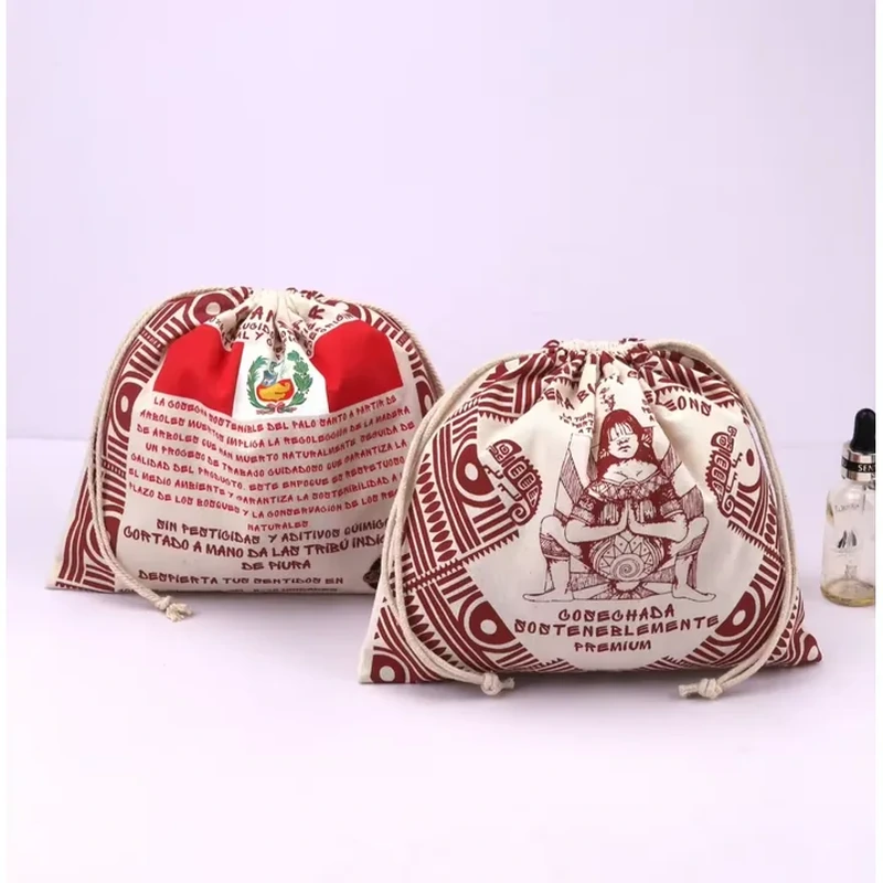 A rounded drawstring sack carries a detailed festive illustration and repeated text across its surface
