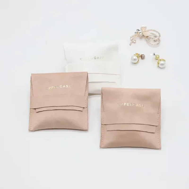 Two curved horizontal bands add a layered detail to a flat jewelry pocket