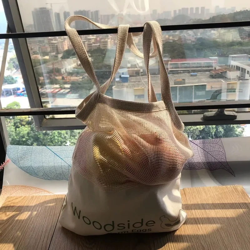 Natural-tone tote with mesh upper body, fabric base and two handles