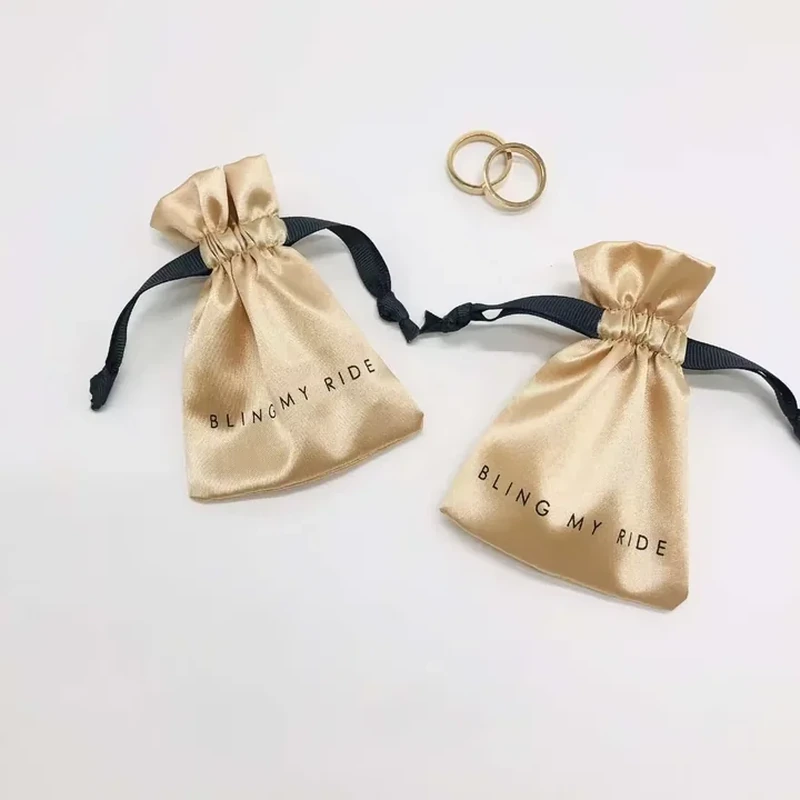 A short satin favor bag has a flared neck and wide contrasting ribbon ties
