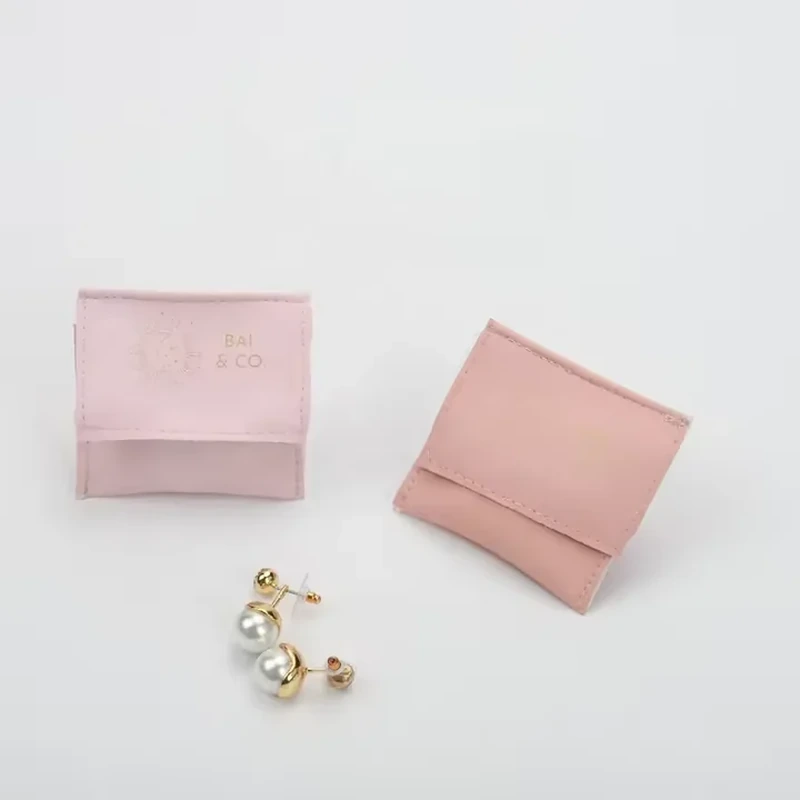 Small pink leather-look jewelry sleeves with plain foldover openings