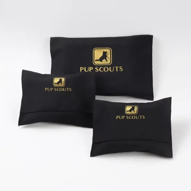 Curved lower edges create a pillow profile around a compact slip-style accessory sleeve