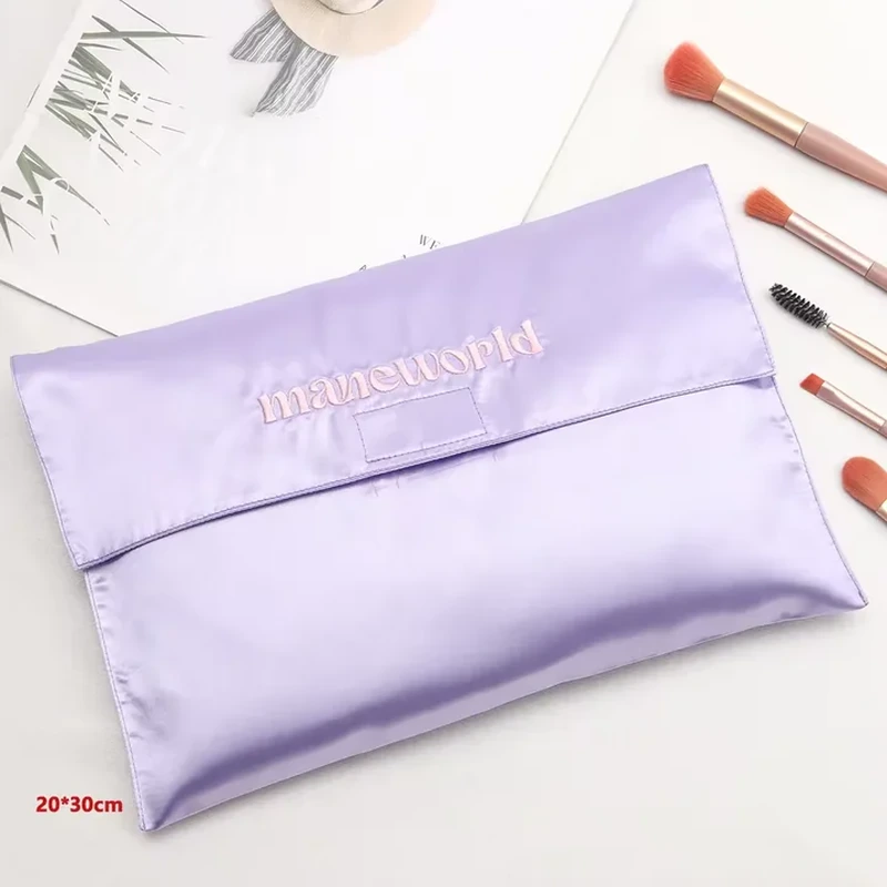 A straight horizontal fold creates a clean opening across this broad flat satin sleeve