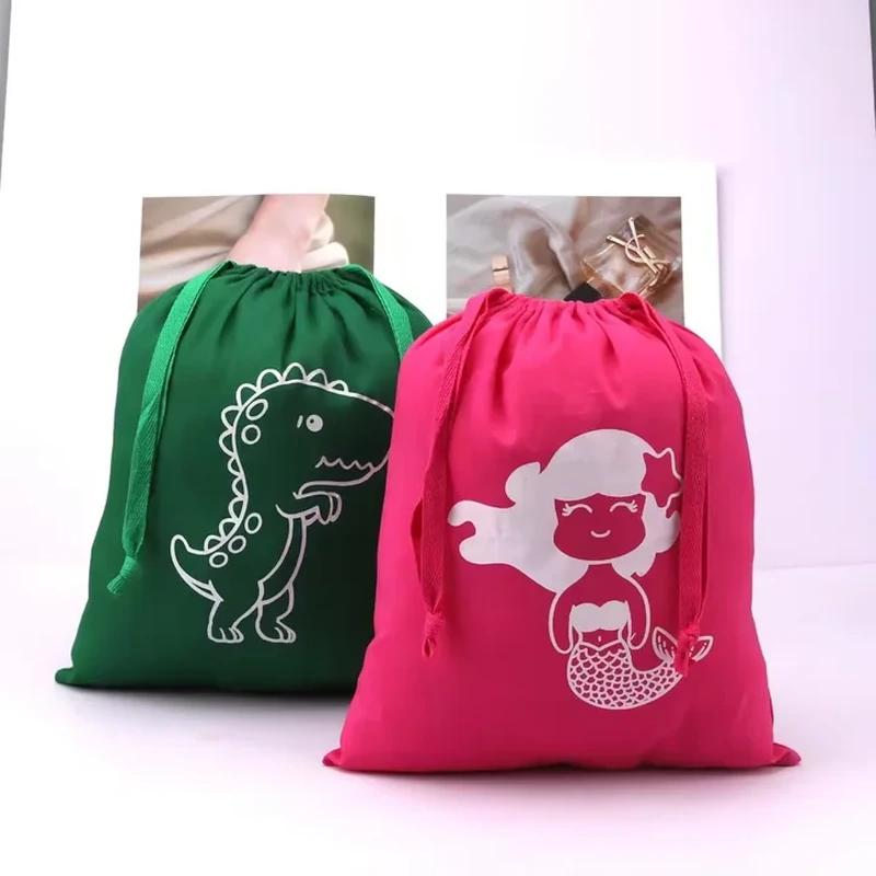 A bright drawstring sack has a large playful character illustration centered on its front