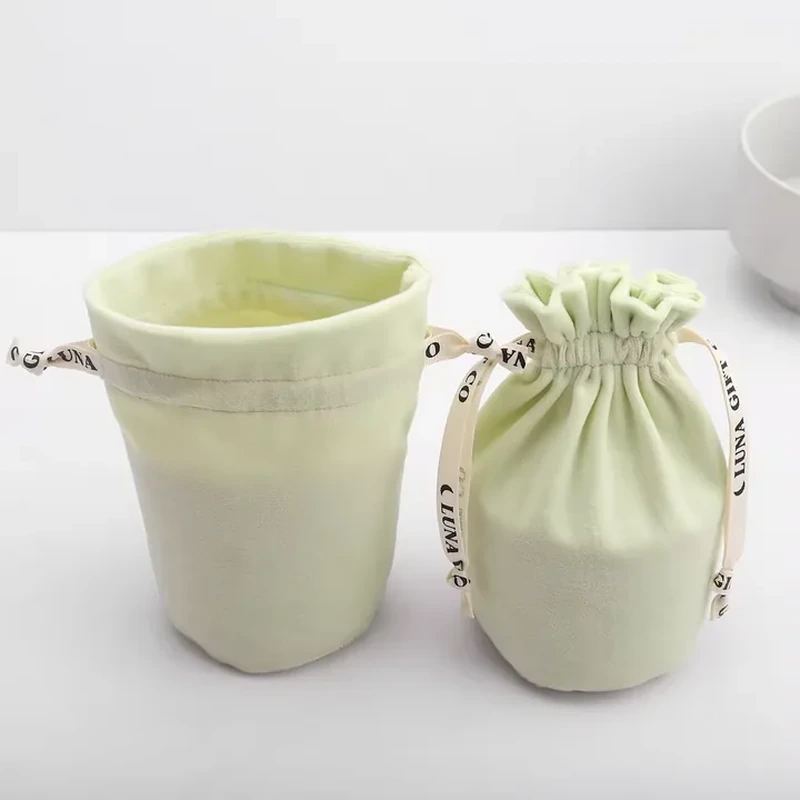 A circular base and upright sides form a cup-shaped pouch with a gathered closure