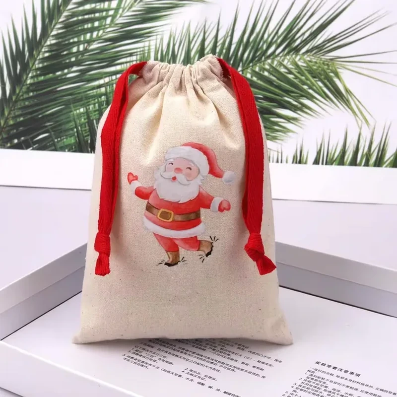 A natural tone sack has contrasting red cords and a large Santa illustration on the front