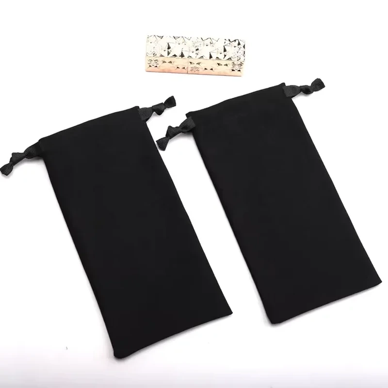 A narrow dark sleeve has a straight rectangular body and short side drawstrings
