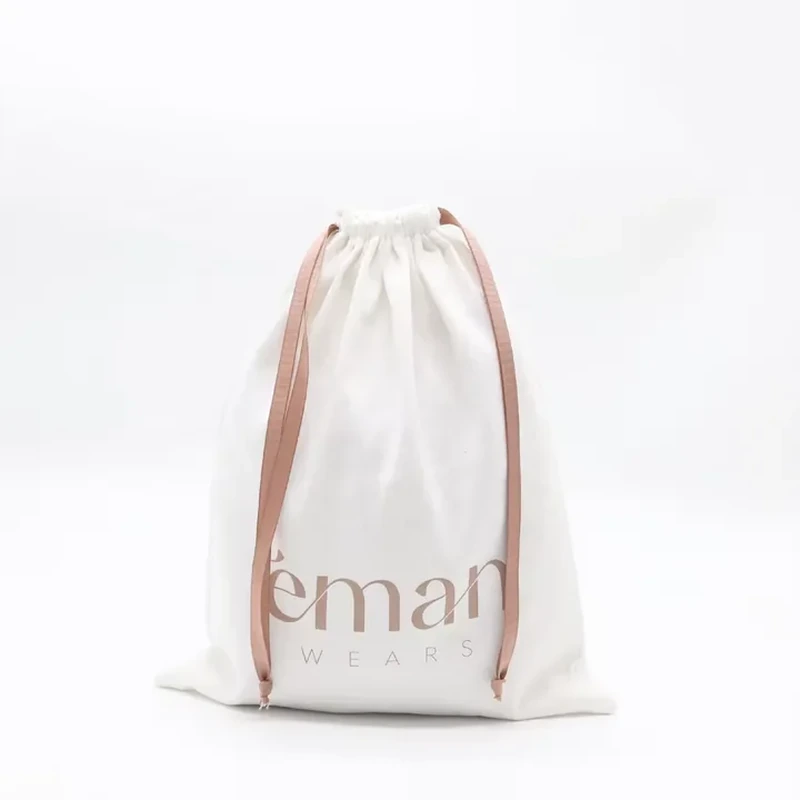 A tall ivory pouch combines a slim profile with pale ribbons and a printed lower panel