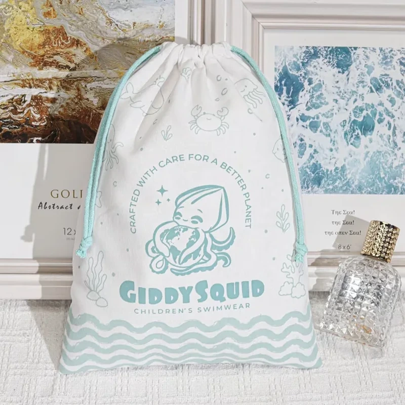 A pale sack combines a squid illustration with a repeated wave border along the bottom
