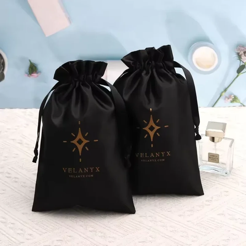 A simple star motif sits below the ruffled opening of this tapered satin bag