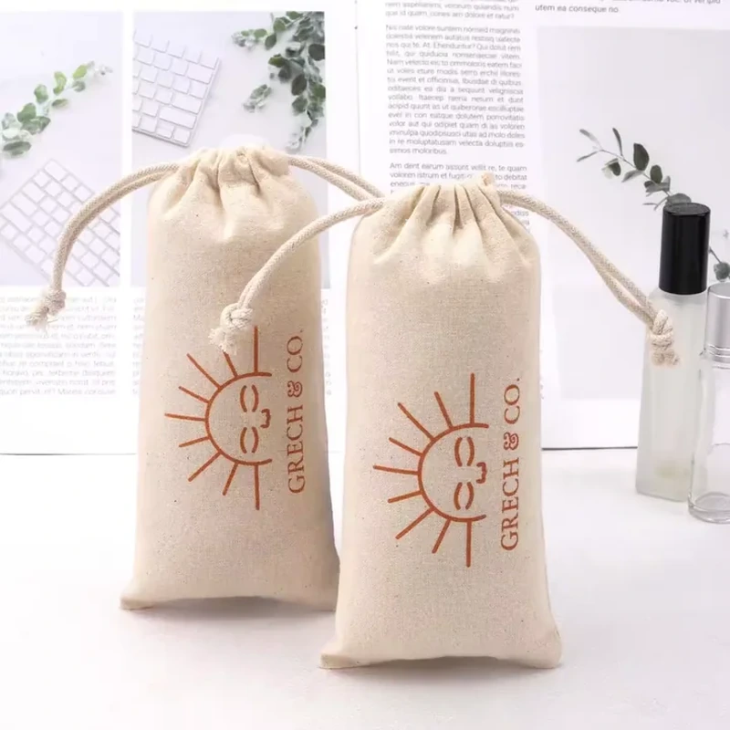 A tall narrow pouch features a simple sun illustration and a straight elongated body