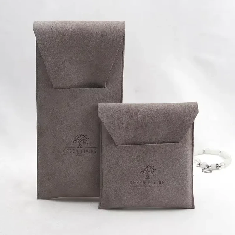 A deep top flap folds over a tall, clean rectangular body with stitched edges