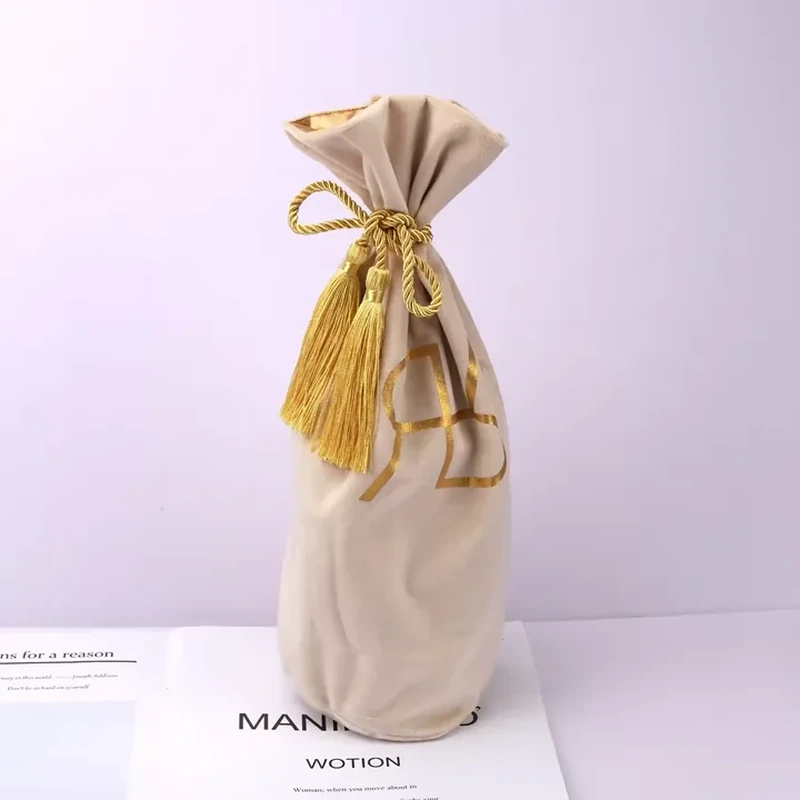 A tall bottle-shaped sleeve gathers below a flared top and long decorative tassels