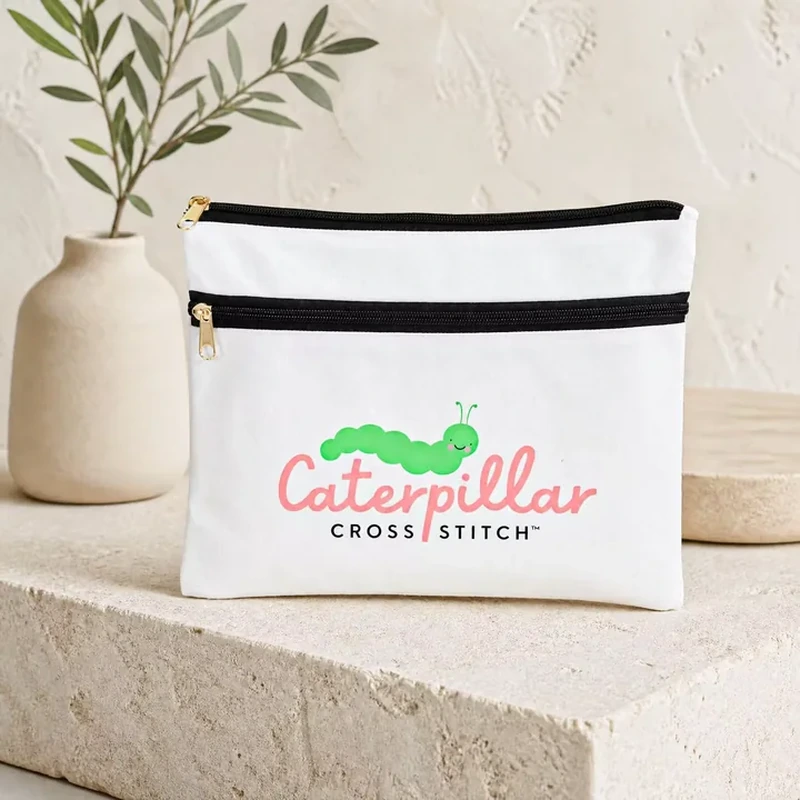 White accessory pouch with separate black top and front pocket zippers