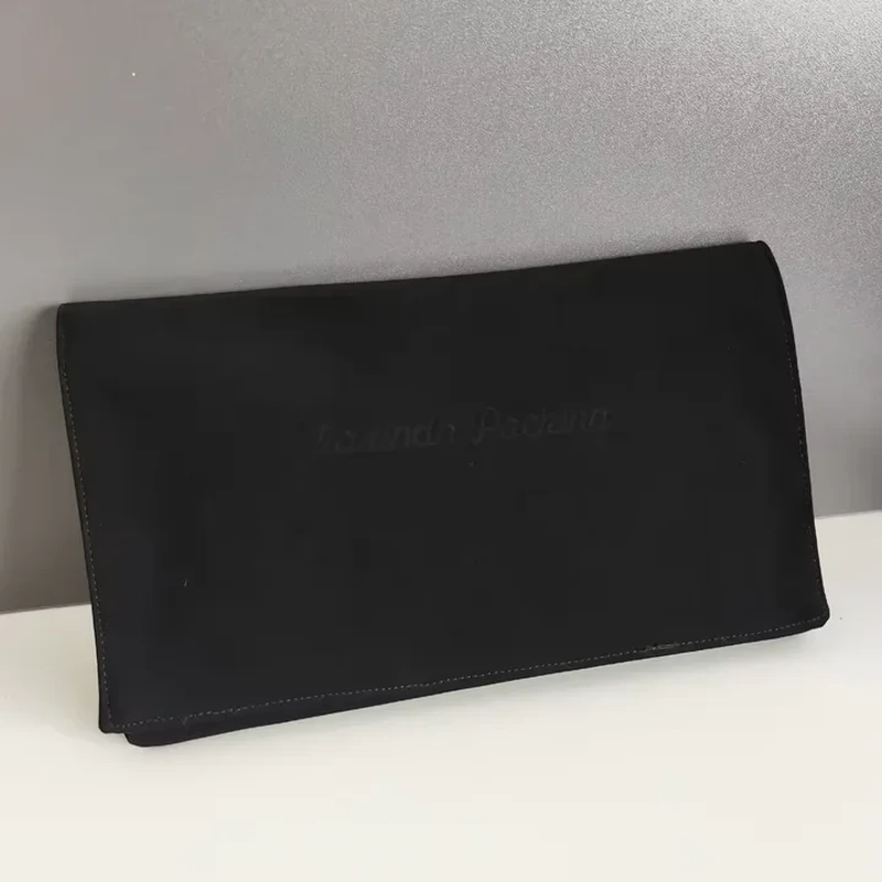 Wide black leather-look wallet pouch with plain foldover flap