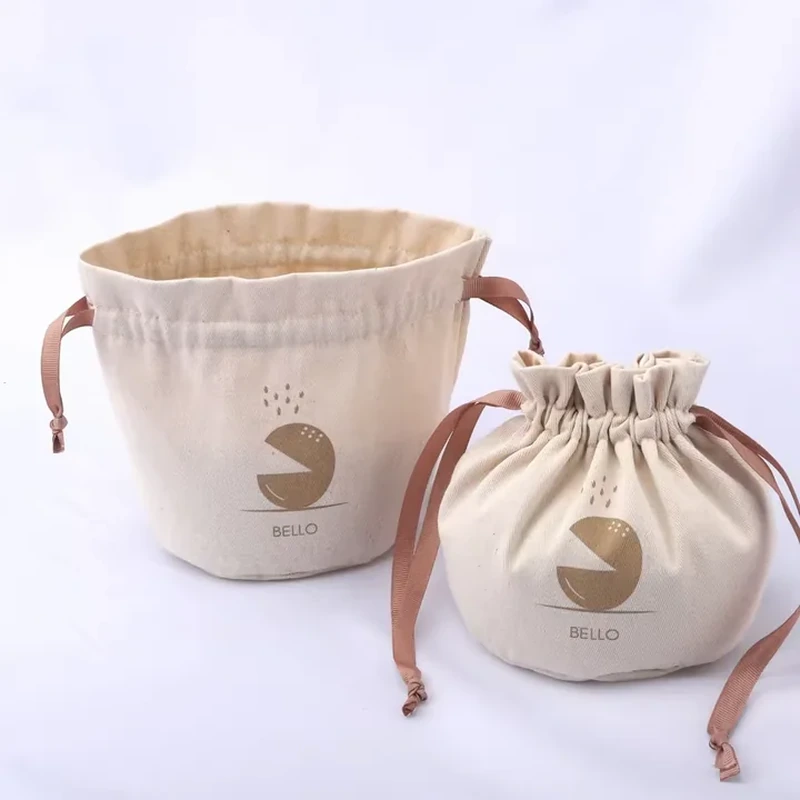 A short round pouch has a wide gathered opening and ribbons extending from the sides