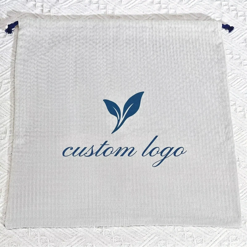 Pale pouch with a herringbone pattern and a blue leaf logo.