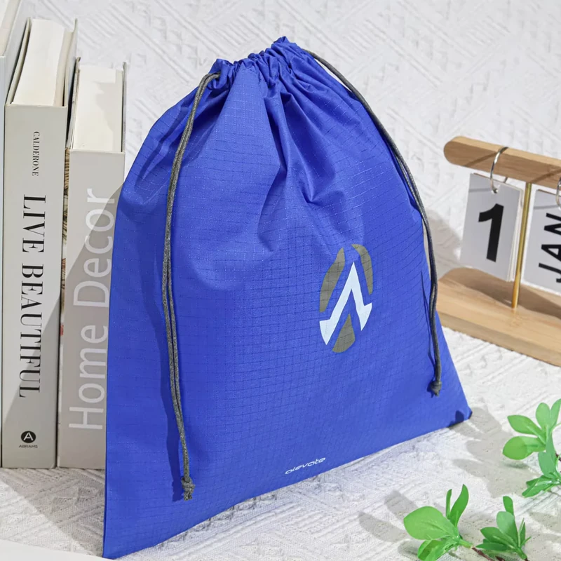 Blue drawstring bag with a pale geometric logo