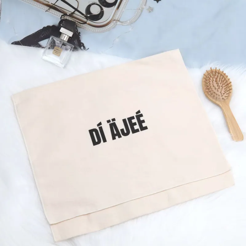 Natural woven fabric pouch with a bold black printed wordmark.