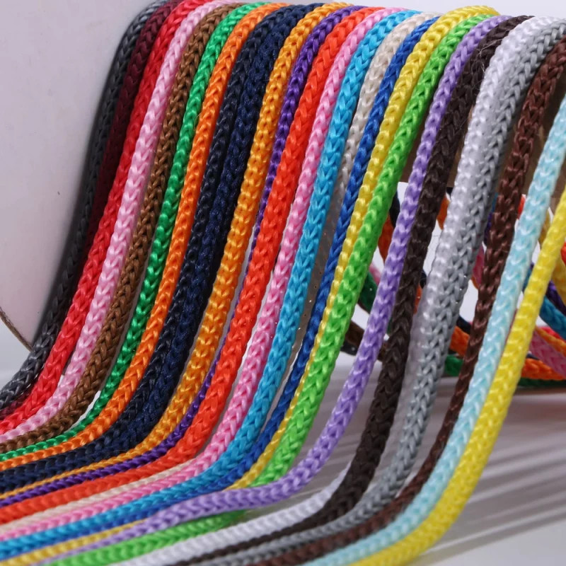 Close-up of braided drawstring cords in many colors.