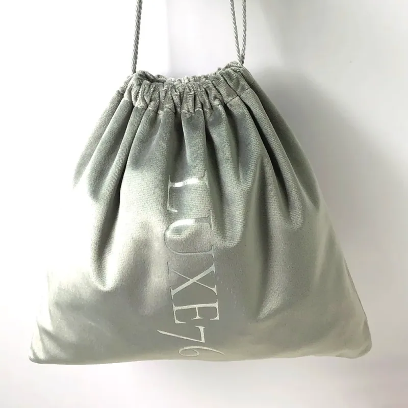 Glossy gray drawstring pouch with a softly gathered top.