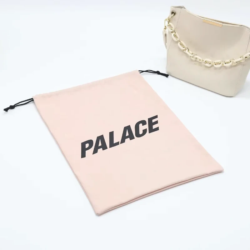 Flat pink pouch with bold black lettering