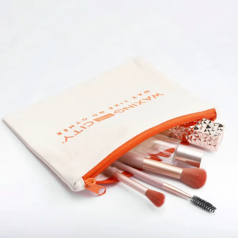 Cream cotton zipper pouch holding makeup brushes and pencils