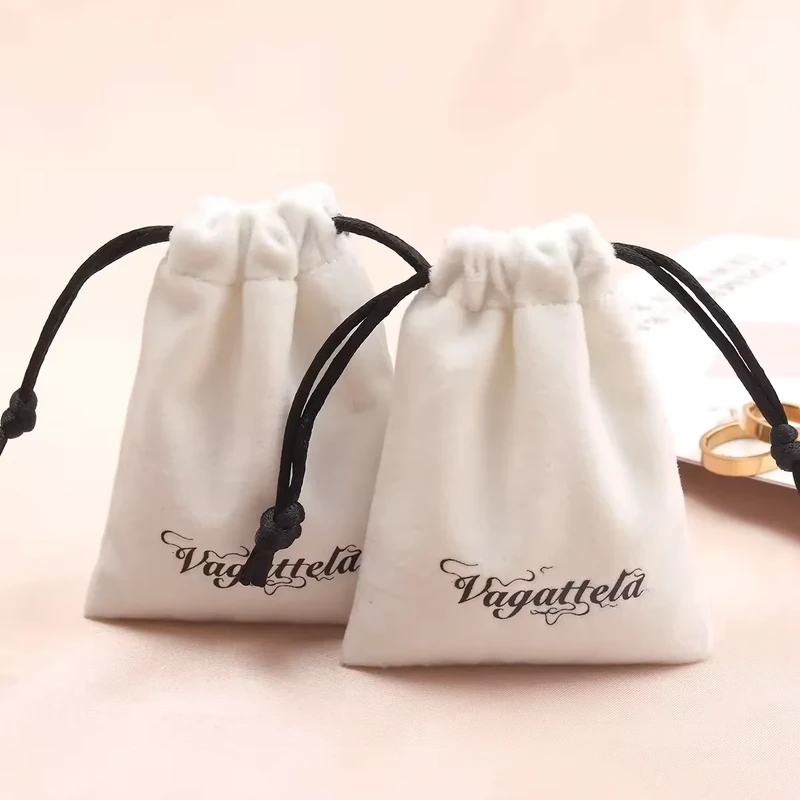 Ivory drawstring gift pouches in two sizes with black cords