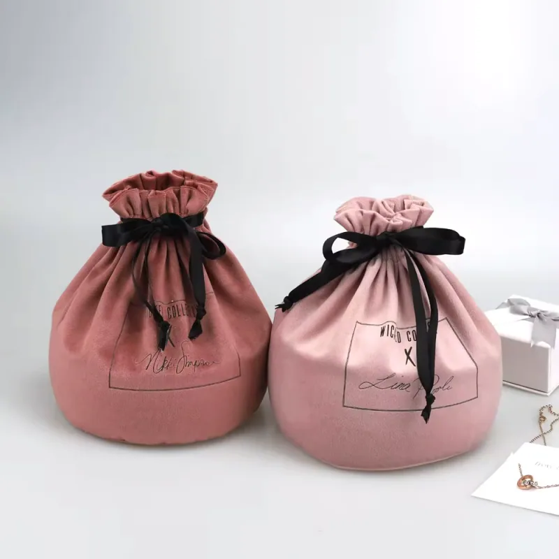 Pink round gift pouches with contrasting dark drawstrings