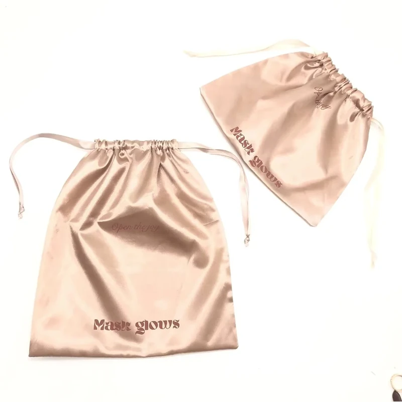 Rose-gold satin gift pouches shown flat and gathered