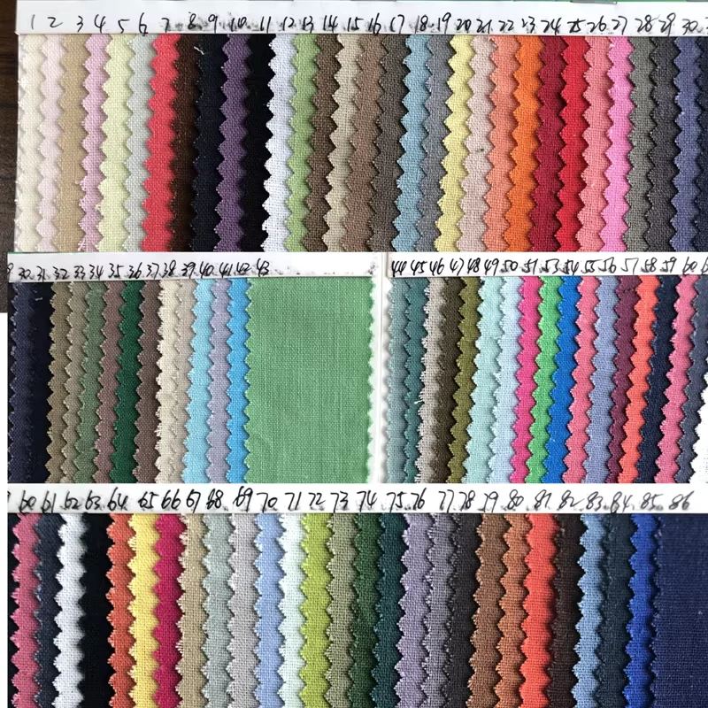 Three rows of woven fabric swatches in neutral and bright colors with reference numbers