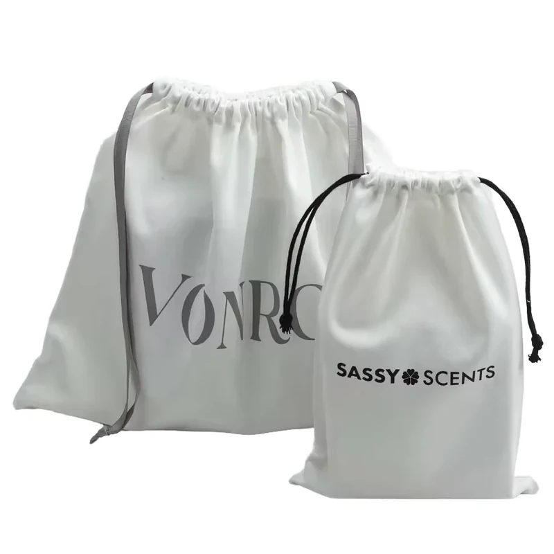 Coordinated gray drawstring pouches with contrasting printed brand names