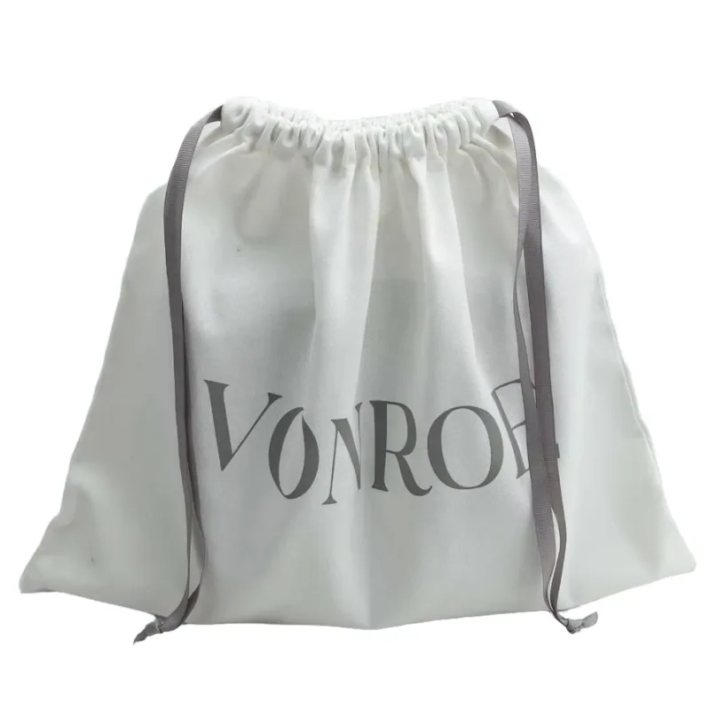 A large gray drawstring travel bag with matching gray ribbon ties.