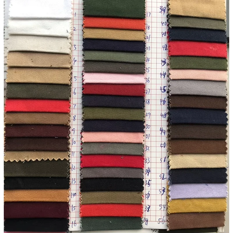 Stacked fabric swatches showing a selection of travel pouch material colors