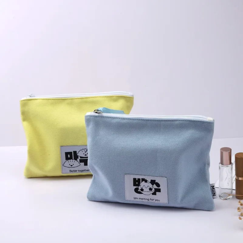 Yellow and blue gusseted zipper pouches standing upright.
