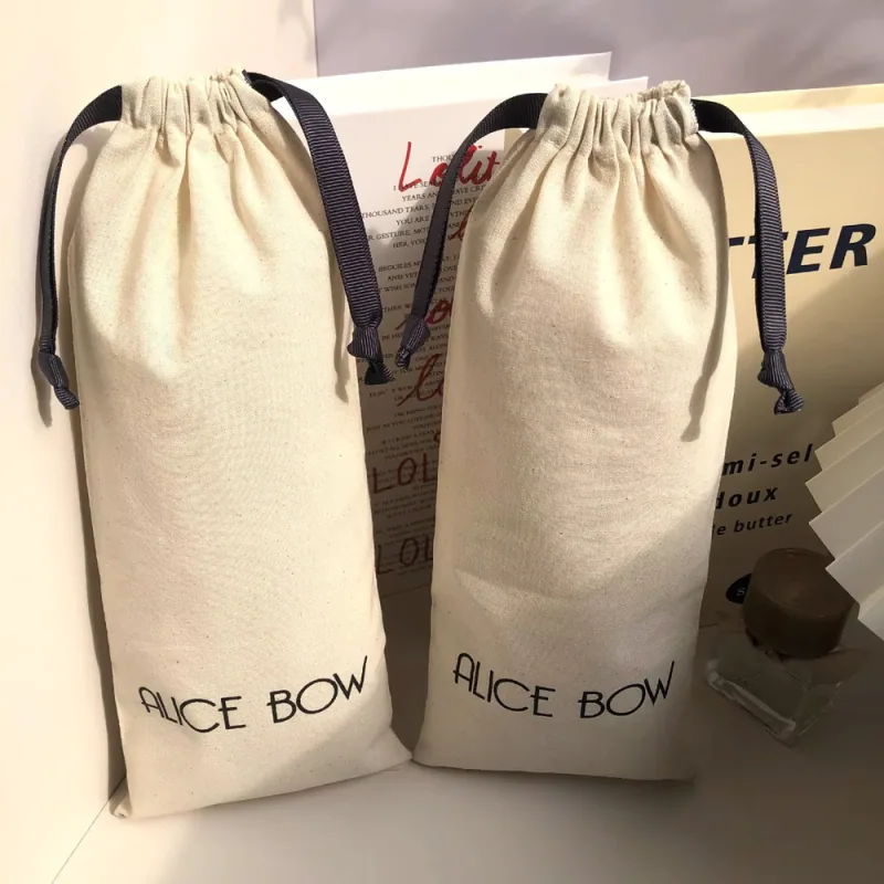 Cotton drawstring bags showing a tall narrow shape.
